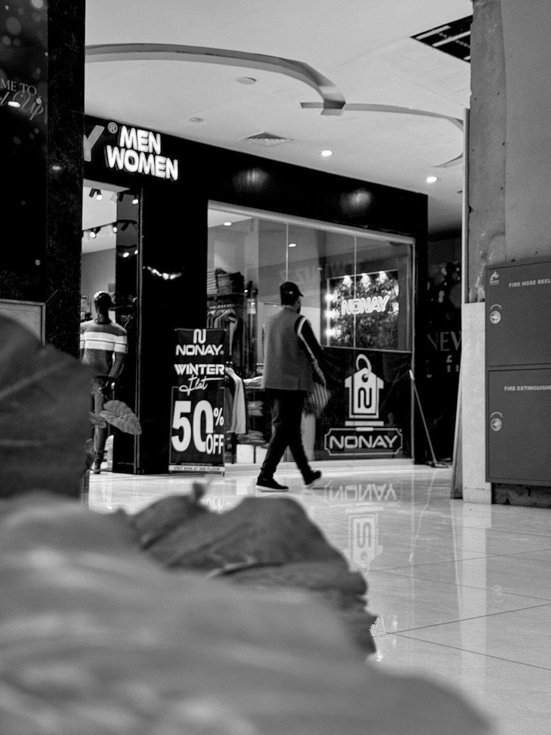 mall security guard watching shoppers