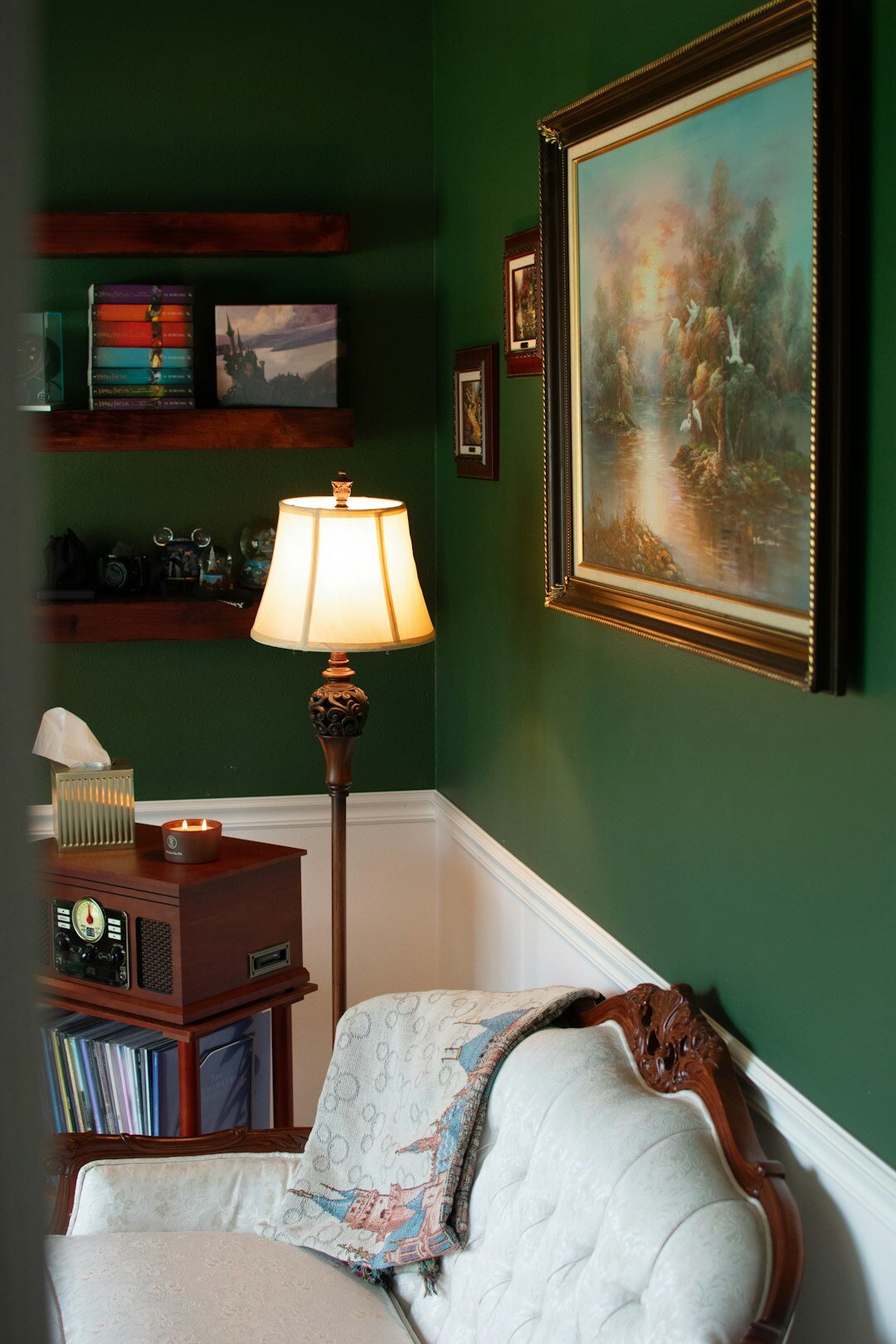 Quiet editorial office with a wooden desk, lamp and bookshelf