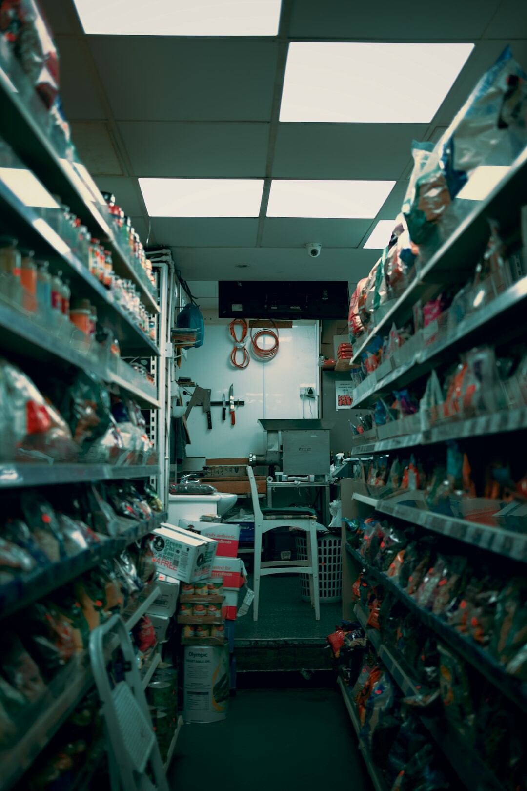 supermarket aisle with shoppers